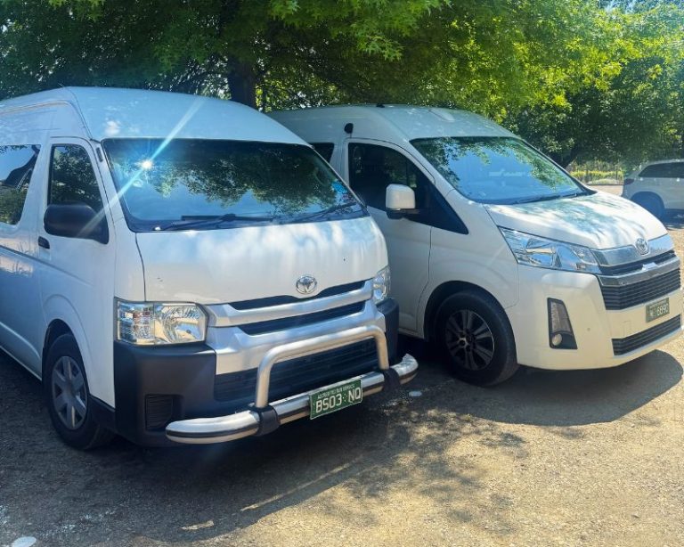 Easy Maxi Cabs branded white maxi van with happy passengers at Melbourne suburb pickup