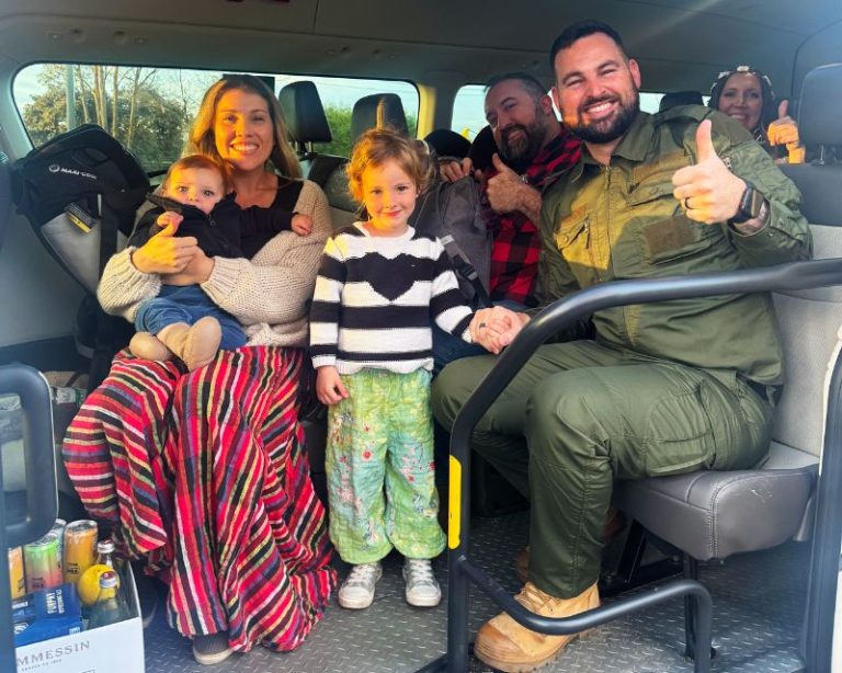 Family with baby seat inside a maxi cab