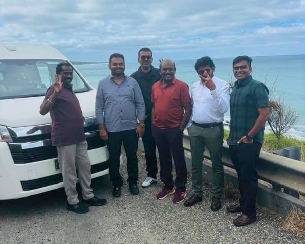 Corporate group boarding a transport van
