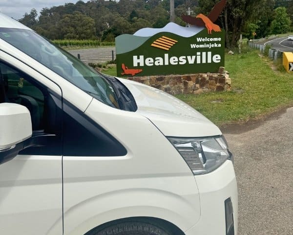 Maxi cab near Healesville welcome sign in Yarra Valley